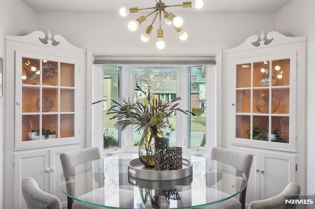 dining area with an inviting chandelier