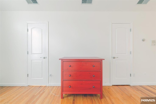 corridor featuring light hardwood / wood-style floors