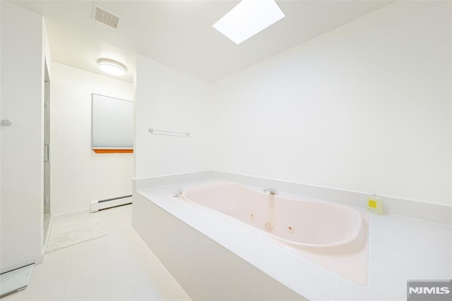 bathroom featuring a baseboard radiator, a tub to relax in, and a skylight