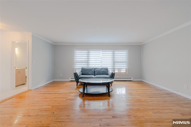 sitting room with ornamental molding, light hardwood / wood-style floors, and a baseboard radiator