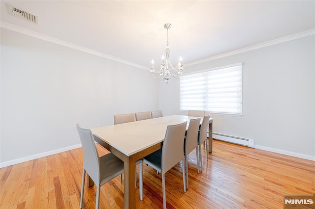 dining space with baseboard heating, light hardwood / wood-style flooring, crown molding, and a chandelier