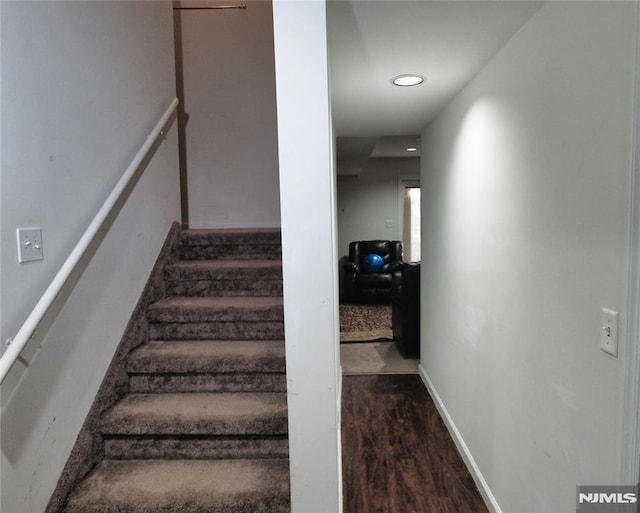 stairs with hardwood / wood-style flooring