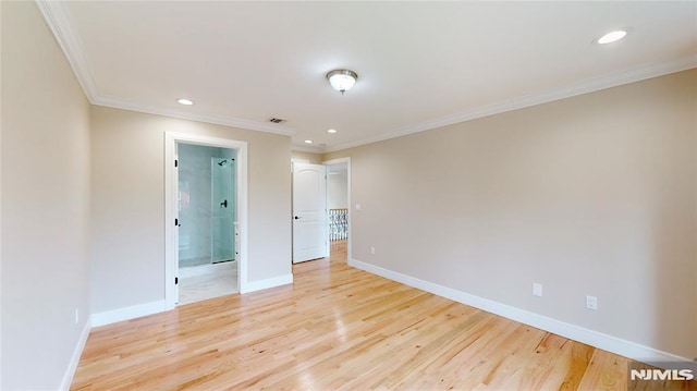 unfurnished room with light hardwood / wood-style floors and ornamental molding