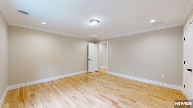 unfurnished room featuring light wood-type flooring and ornamental molding