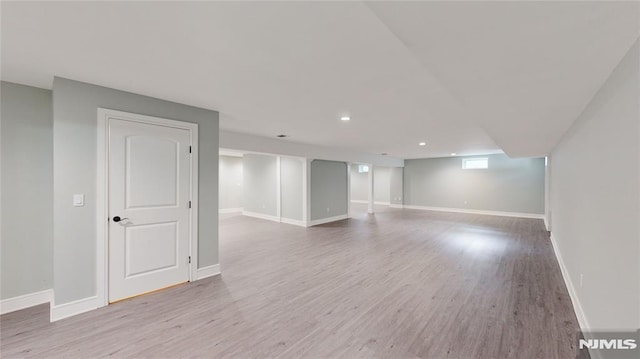 spare room with wood-type flooring