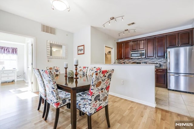 dining room with light hardwood / wood-style floors