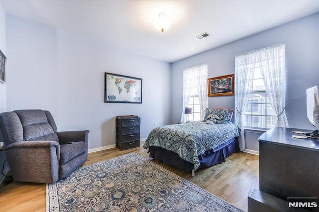 bedroom with light wood-type flooring