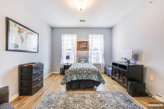 bedroom with light hardwood / wood-style floors