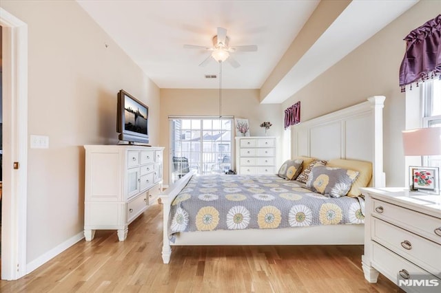 bedroom with light wood-type flooring and ceiling fan