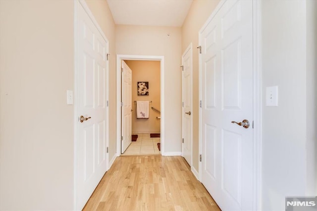 corridor featuring light wood-type flooring