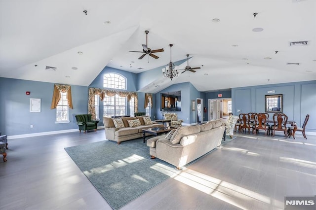 living room featuring ceiling fan, lofted ceiling, and hardwood / wood-style floors