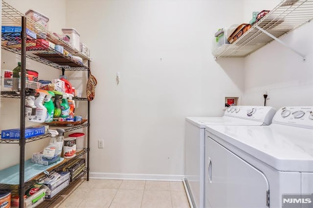 washroom featuring washer and dryer