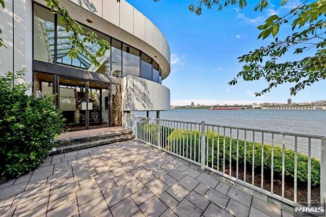 view of patio with a water view