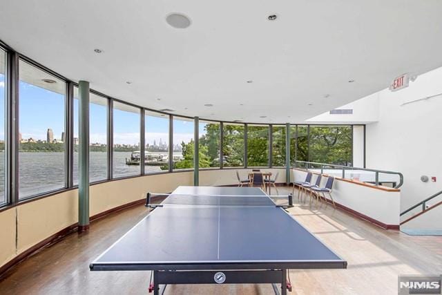 recreation room with a water view