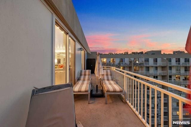 view of balcony at dusk