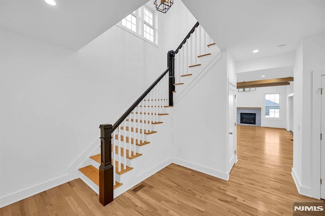 stairway featuring hardwood / wood-style flooring