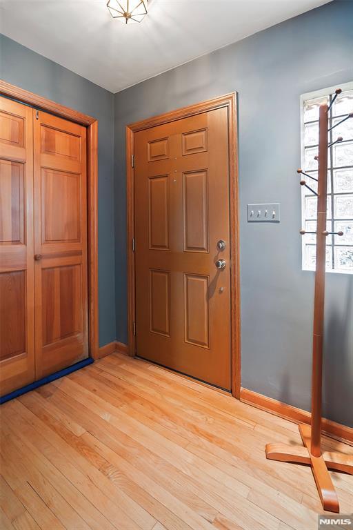 foyer entrance featuring light hardwood / wood-style flooring