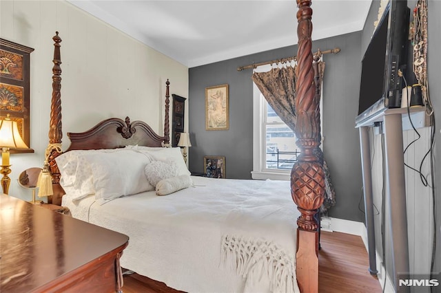 bedroom featuring hardwood / wood-style floors