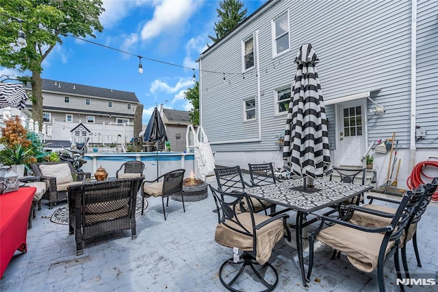 view of patio featuring an outdoor living space and a fenced in pool