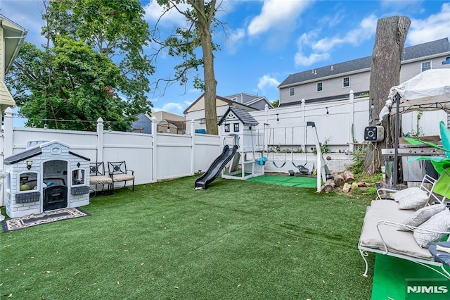 view of yard with a playground