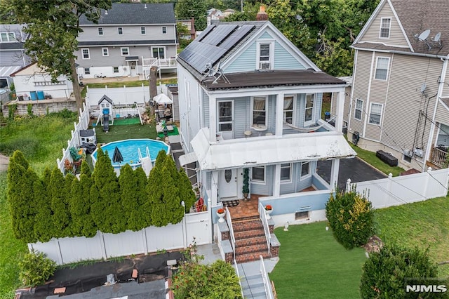 view of front of property with solar panels