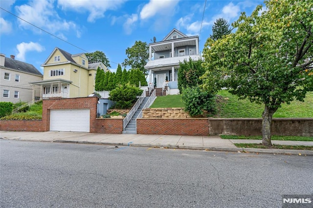 view of front of property with a garage