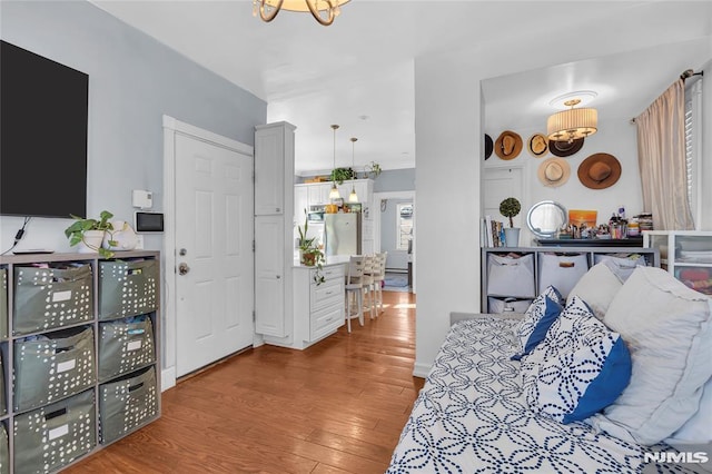 bedroom with hardwood / wood-style flooring