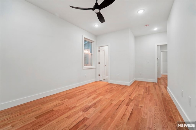 spare room with ceiling fan and light hardwood / wood-style flooring