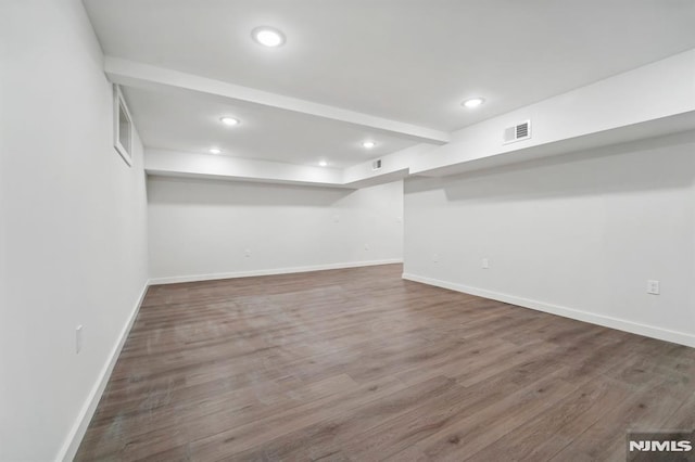 basement featuring hardwood / wood-style flooring