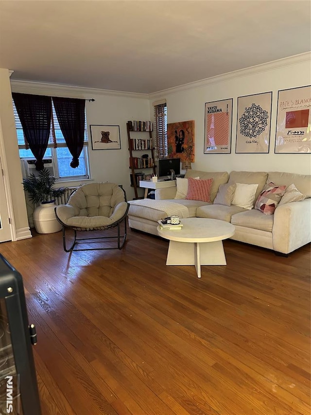 living room with ornamental molding and hardwood / wood-style floors