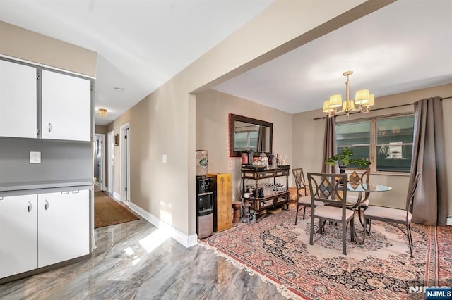 dining area featuring an inviting chandelier