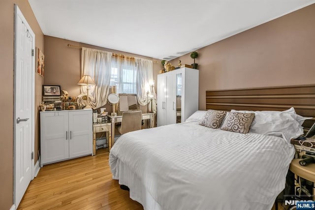 bedroom featuring light wood-type flooring