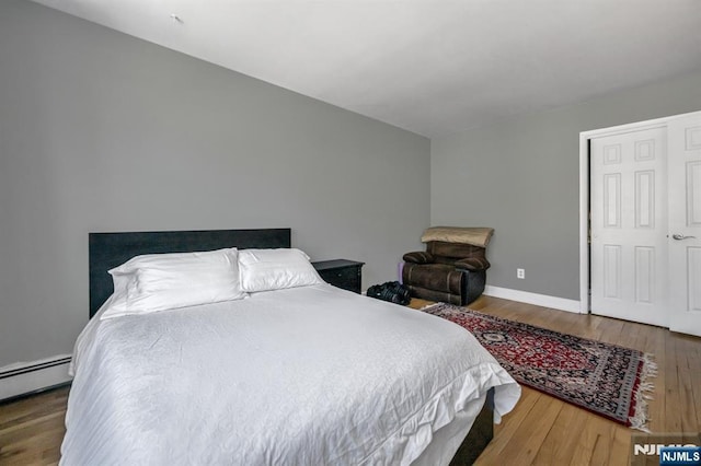 bedroom with hardwood / wood-style floors