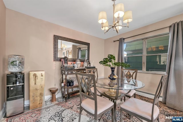 dining room with baseboard heating, tile patterned flooring, and a notable chandelier