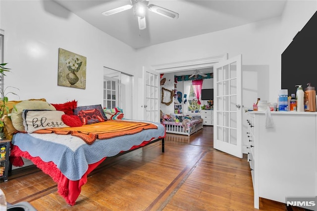 bedroom with hardwood / wood-style floors, ceiling fan, and french doors