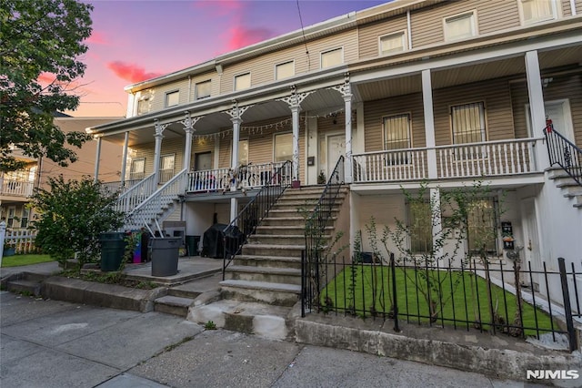 multi unit property featuring a porch