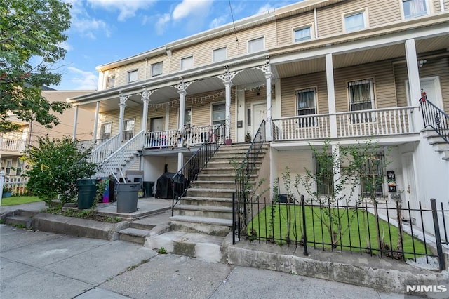 view of property featuring a porch