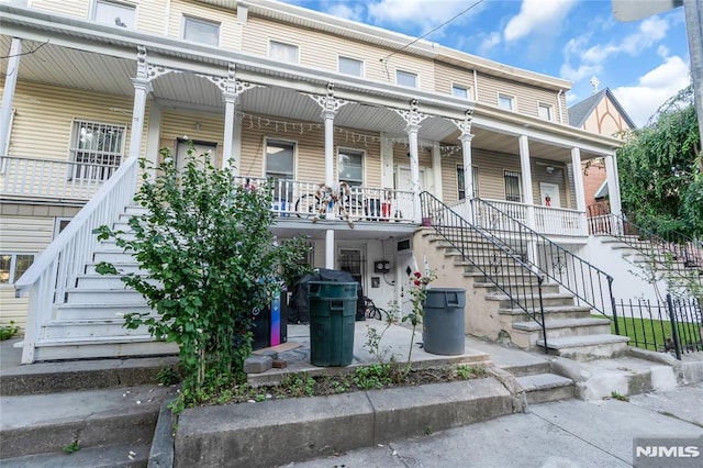 view of property featuring a porch