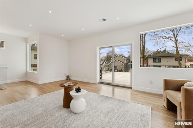 sitting room featuring light hardwood / wood-style floors