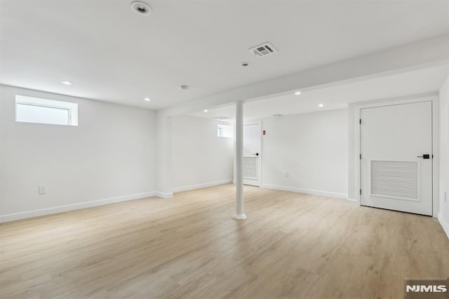 basement featuring light hardwood / wood-style floors