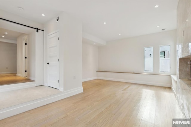 unfurnished room with light hardwood / wood-style flooring