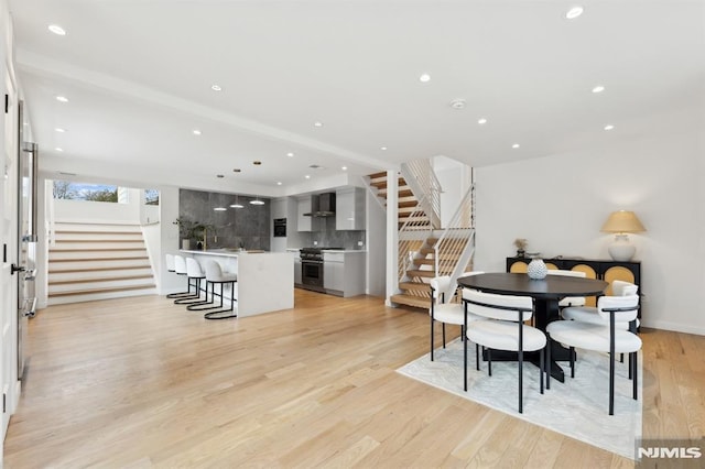 dining space featuring light wood-type flooring