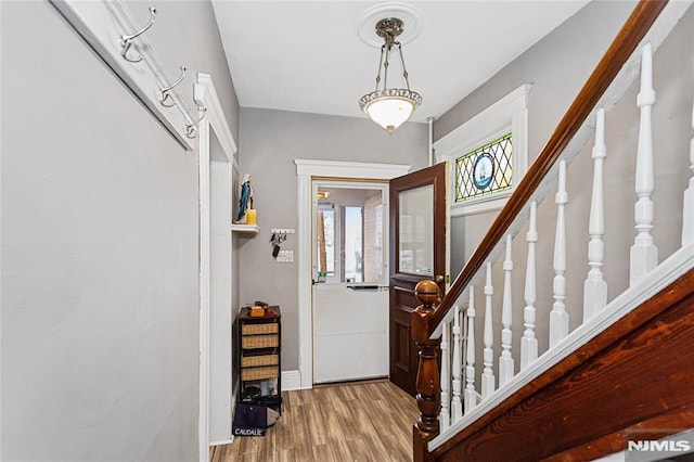 entryway with hardwood / wood-style flooring