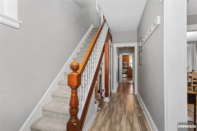 stairs with wood-type flooring