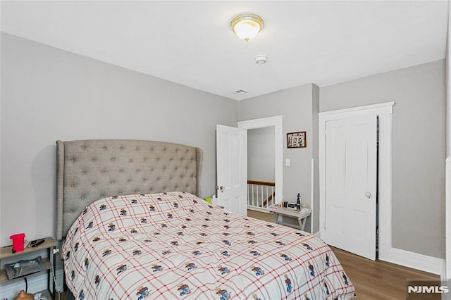 bedroom featuring hardwood / wood-style flooring