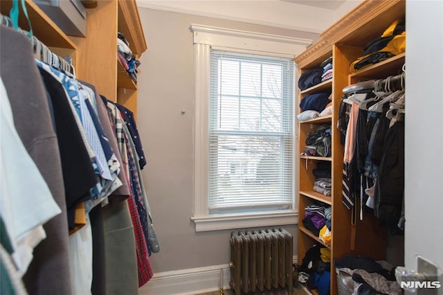 walk in closet featuring radiator heating unit