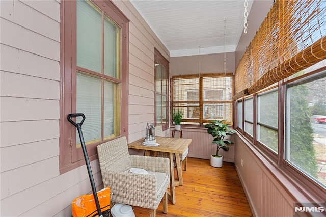 sunroom / solarium featuring a healthy amount of sunlight