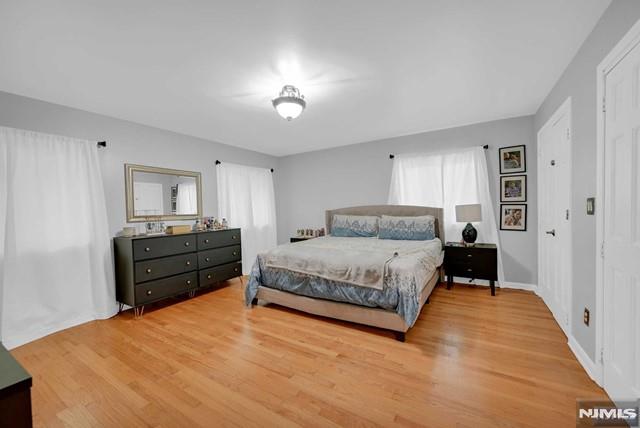 bedroom with hardwood / wood-style flooring