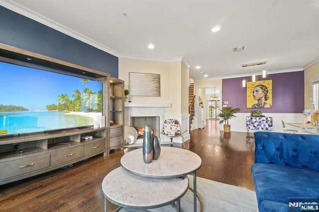 living room with crown molding, a healthy amount of sunlight, and dark hardwood / wood-style floors