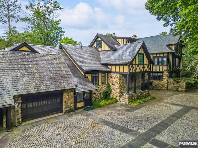 tudor home with a garage